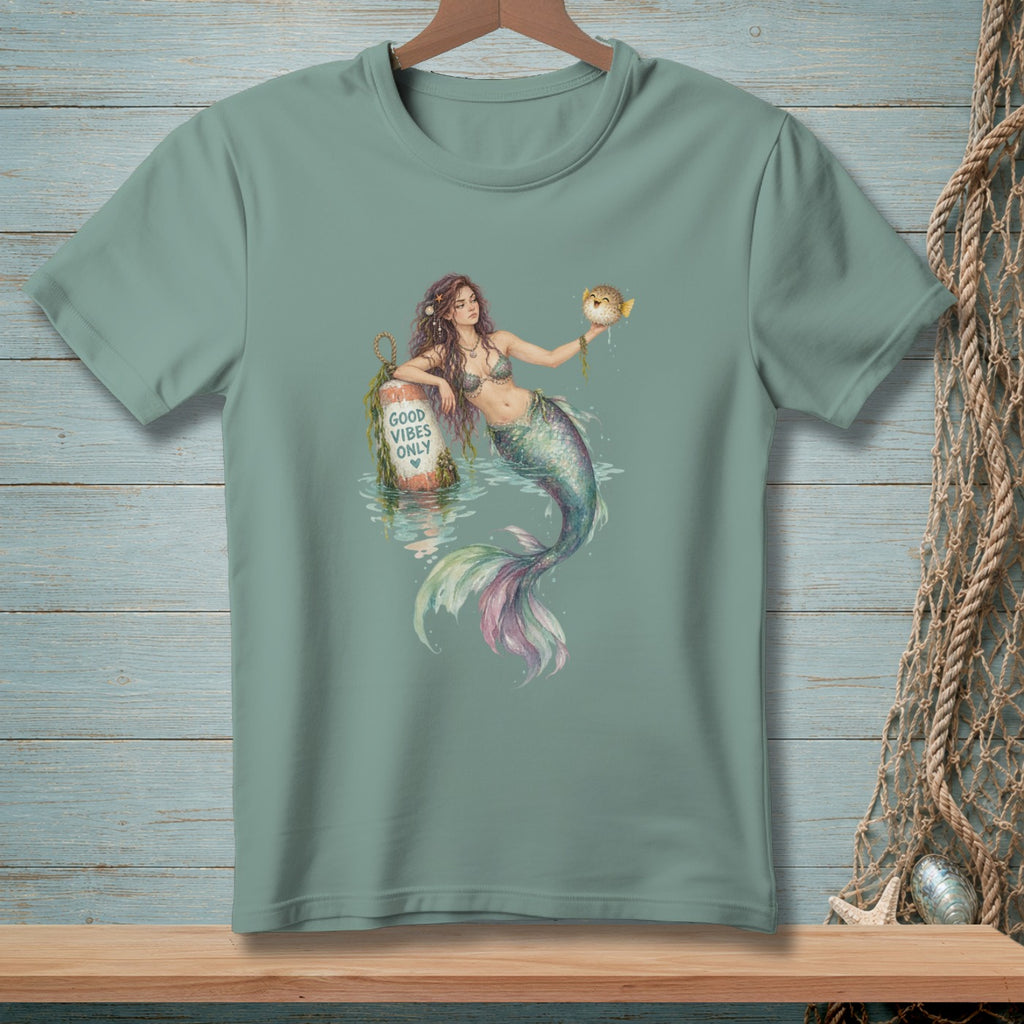 Mermaid with pufferfish and "Good Vibes Only" buoy graphic on t-shirt.