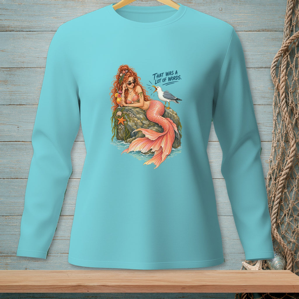 Mermaid with sunglasses and drink on rock next to seagull saying "That was a lot of words."