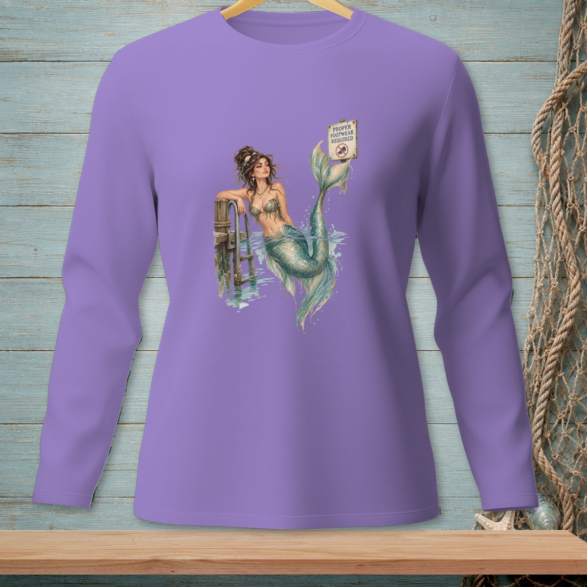 Purple long-sleeve shirt featuring a mermaid with a "Proper Footwear Required" sign.