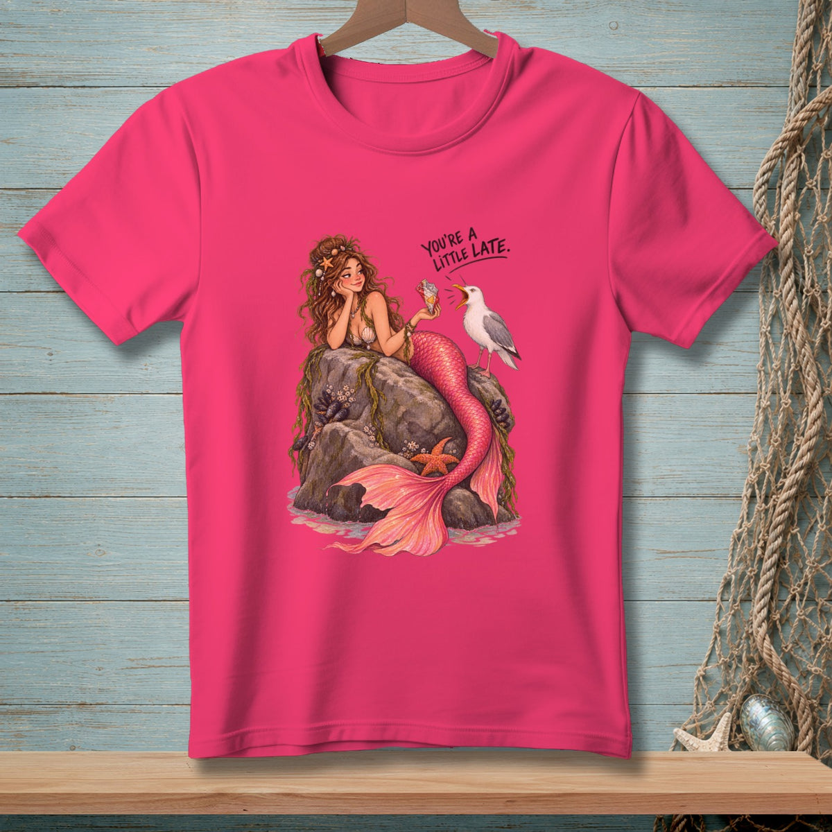 Pink t-shirt with mermaid, seagull, and text "You're a little late."