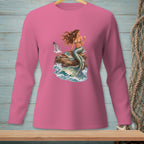 Mermaid with seagull and cocktail on rock with crashing waves design on pink shirt.