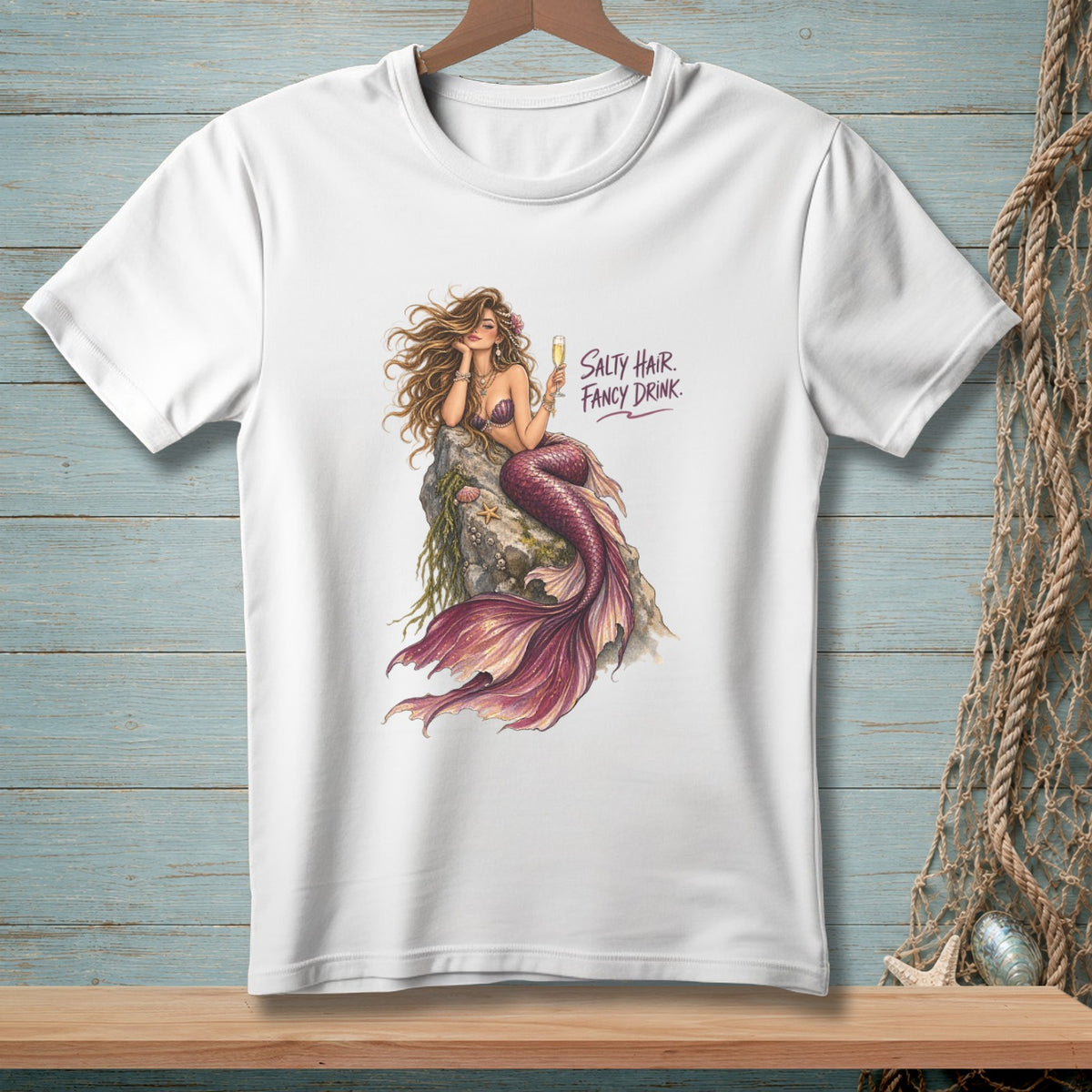 White t-shirt with mermaid artwork and "Salty Hair. Fancy Drink." text.
