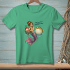 Mermaid and pufferfish on green t-shirt with text "That's a lot of drama per inch."