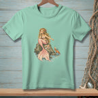 Mint t-shirt featuring a mermaid sitting on a rock with a crab nearby.