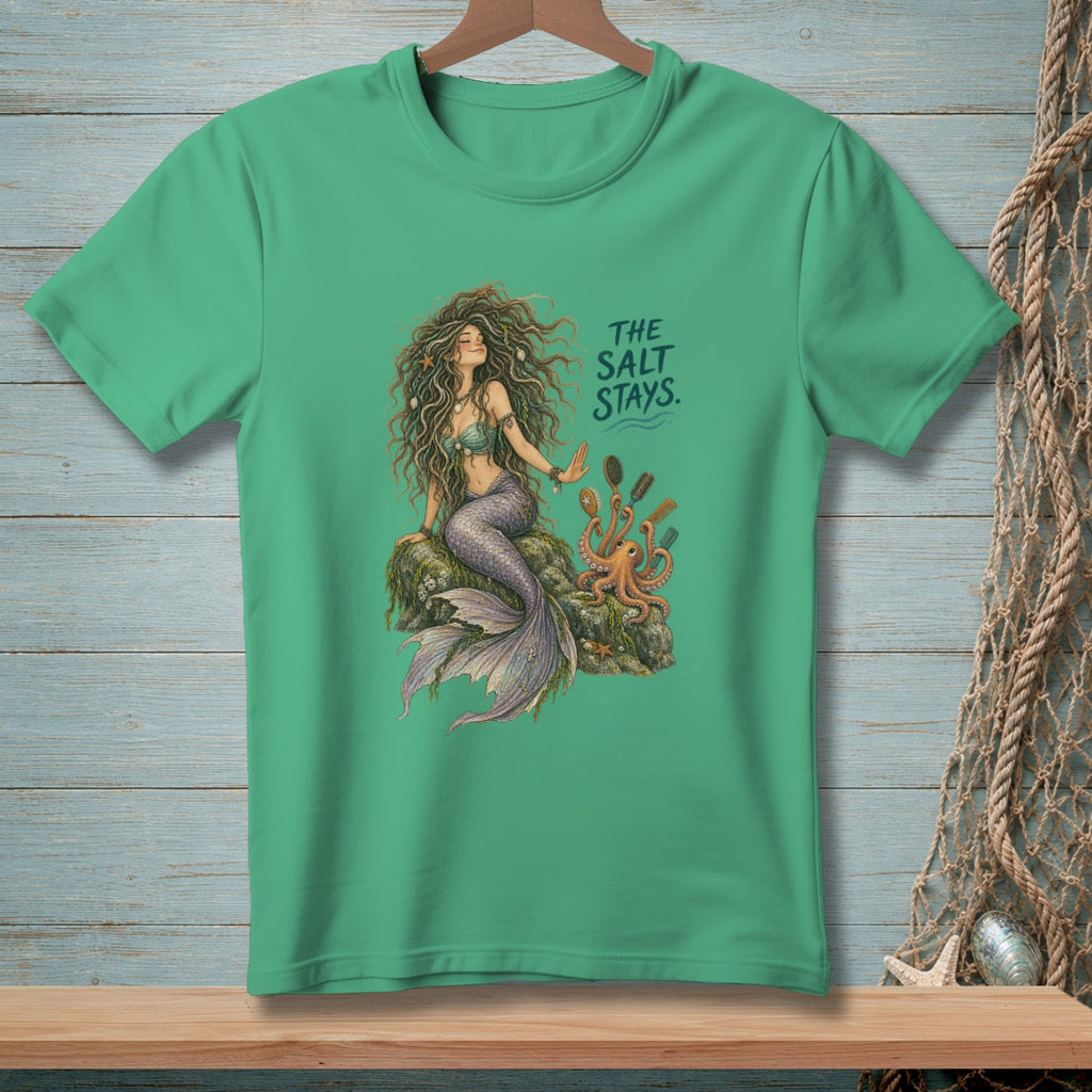 Mermaid on a rock with octopus and combs, text reads "The Salt Stays."