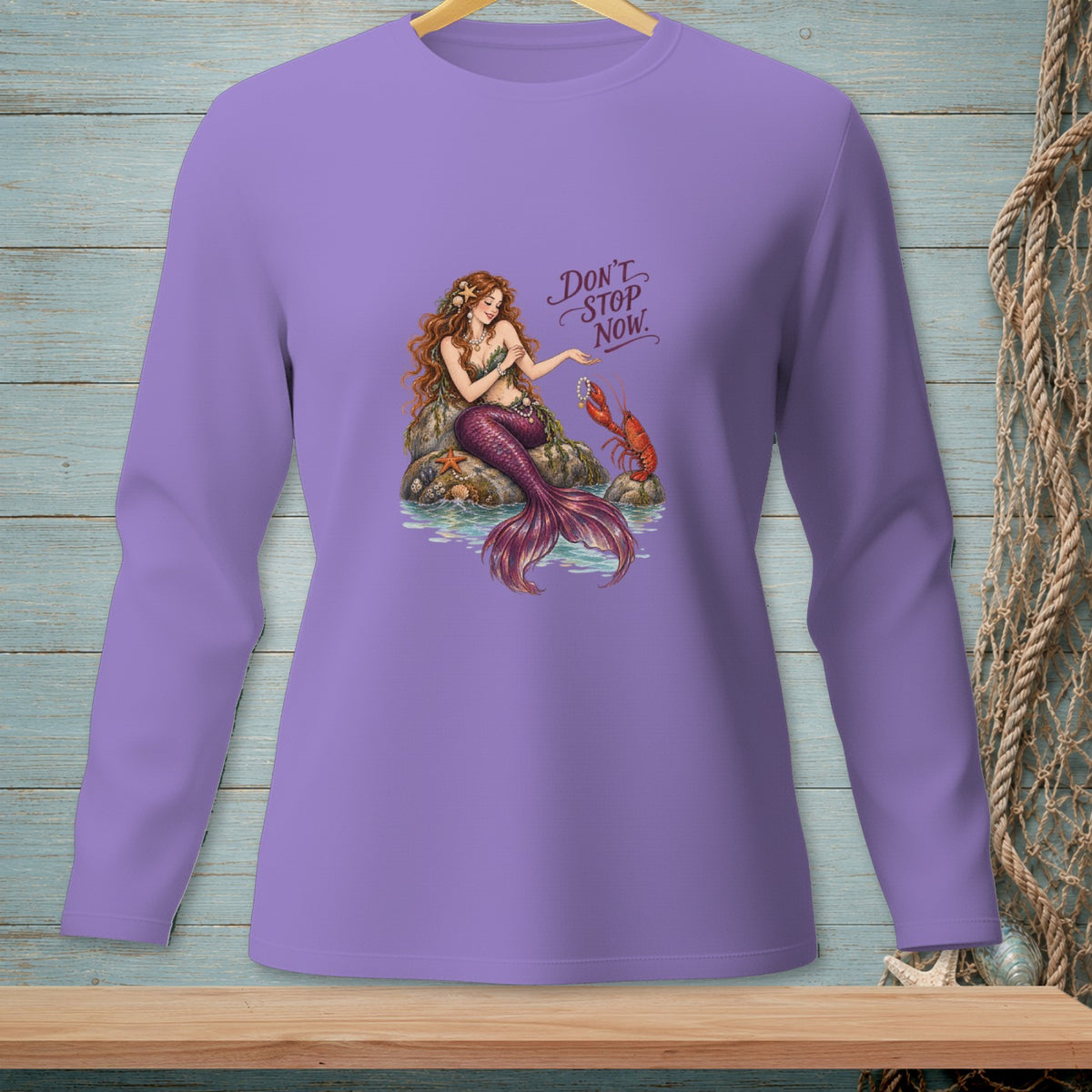 Mermaid with lobster and starfish on rock, "Don't Stop Now" text.