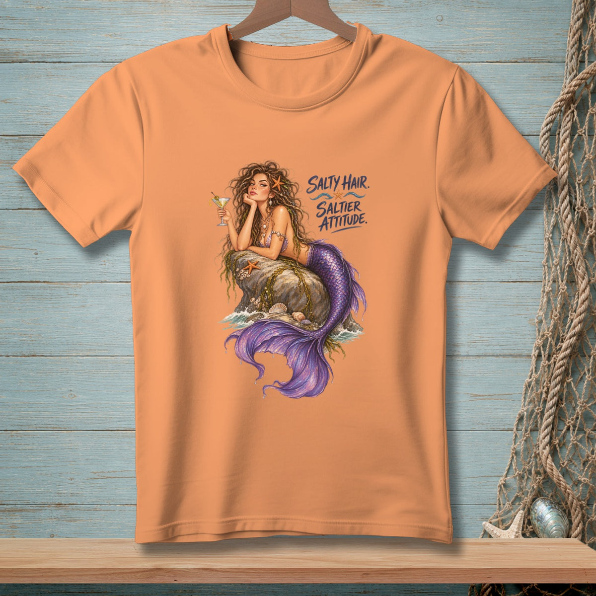 Orange t-shirt with mermaid graphic and "Salty Hair. Saltier Attitude." text.