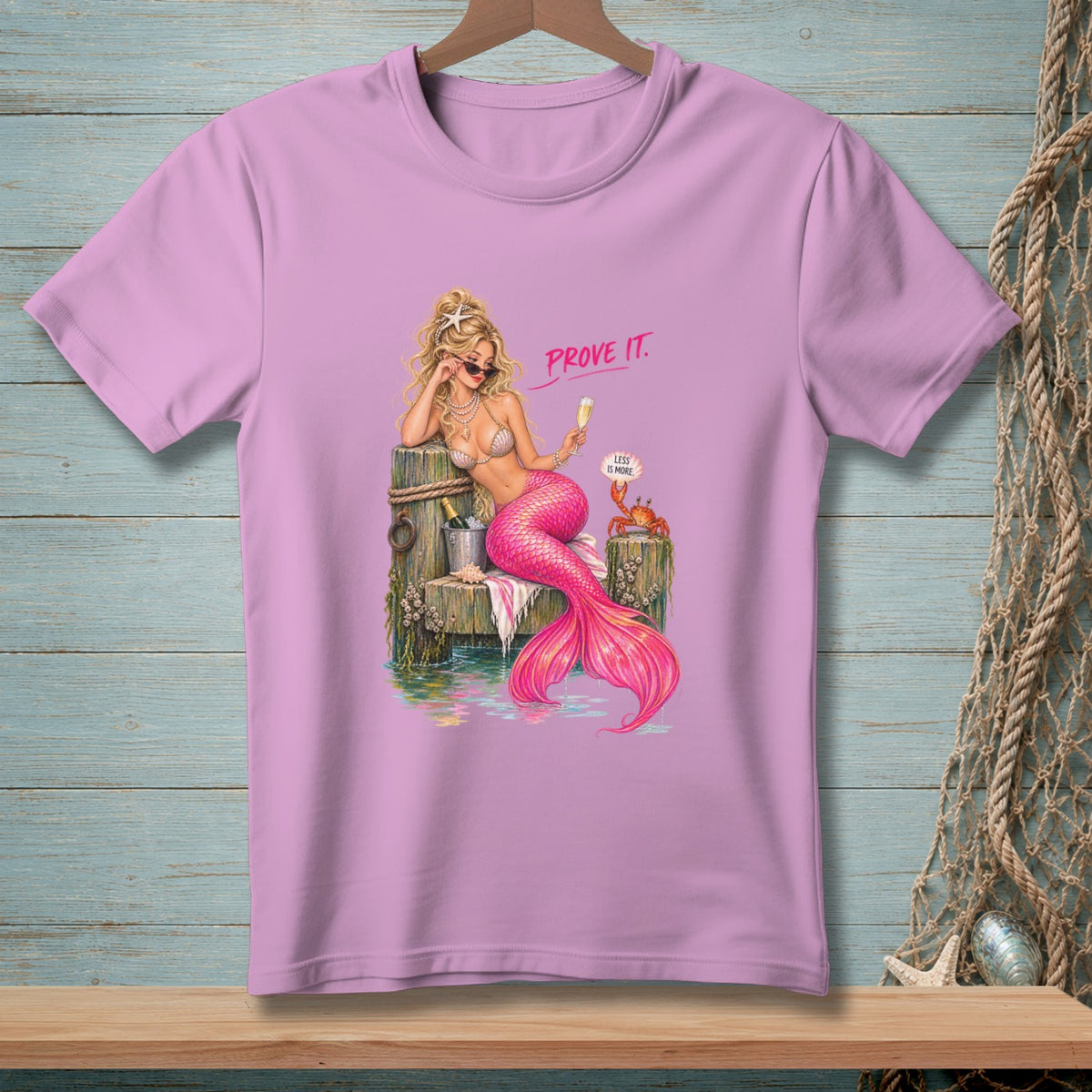 Pink t-shirt featuring a blonde mermaid with a pink tail saying "Prove It."