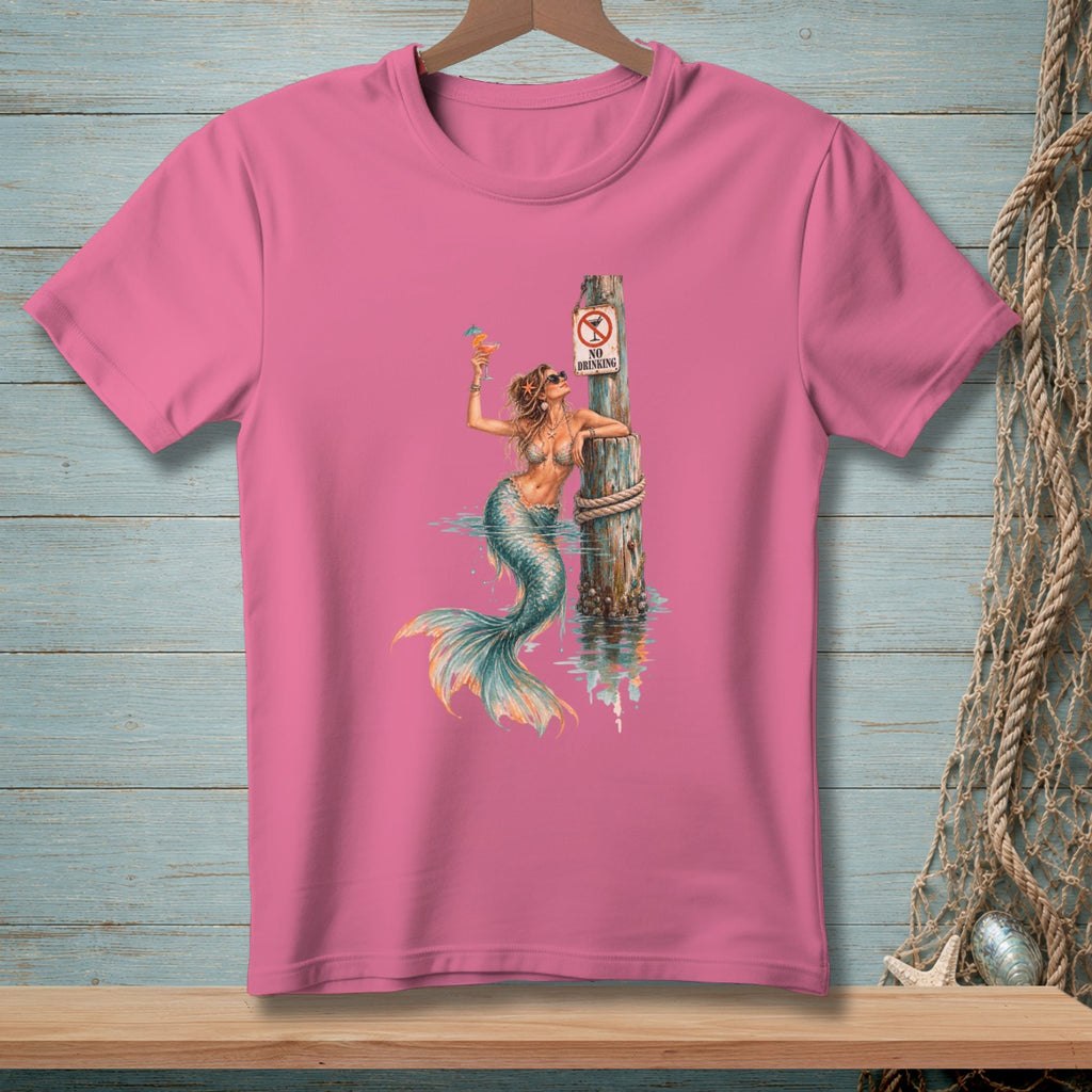Mermaid with cocktail leans on post with "No Drinking" sign on a pink t-shirt.