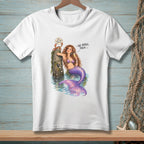 Mermaid with purple tail leans on post with crab saying "We agree, then."