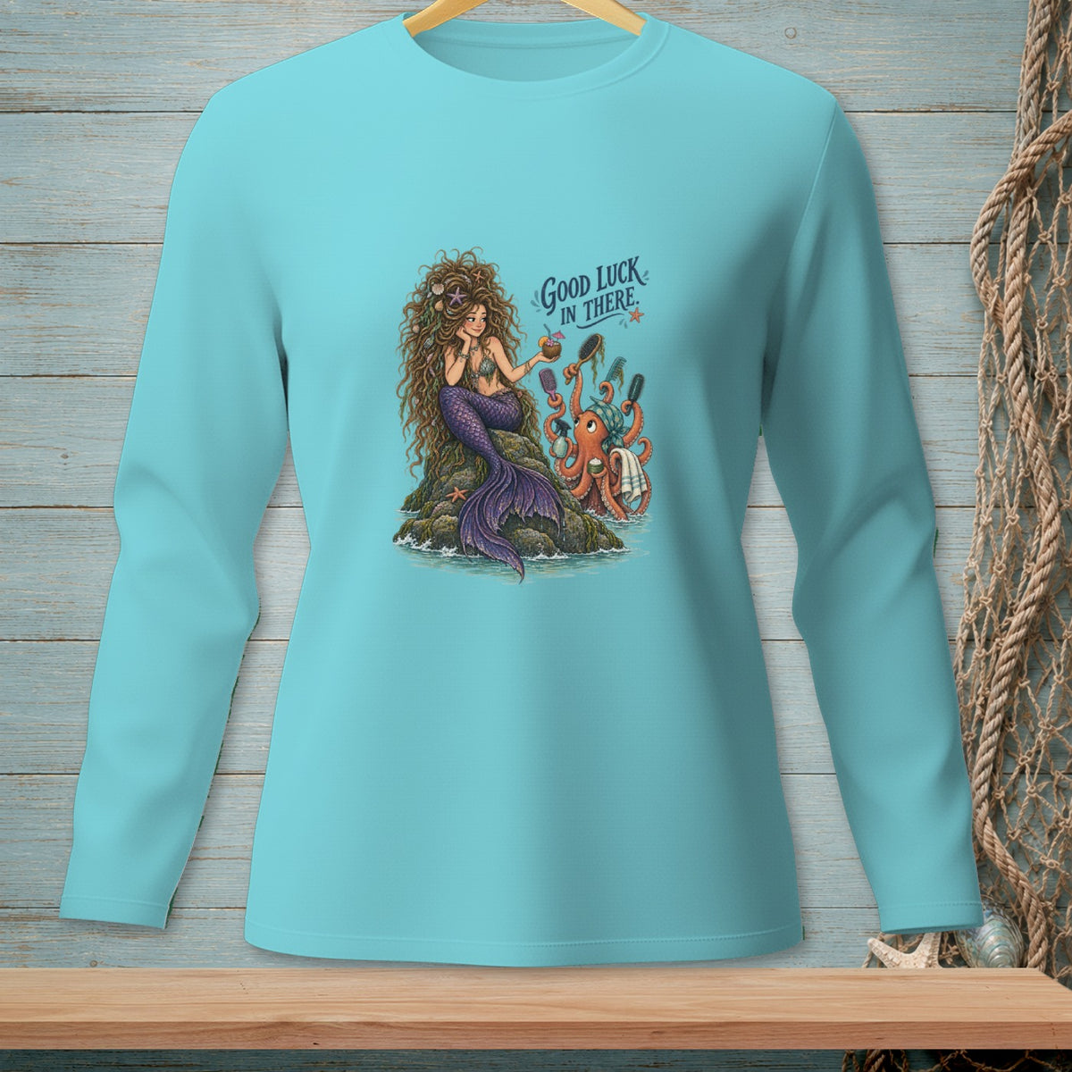 Mermaid and octopus on a rock with text "Good Luck In There".