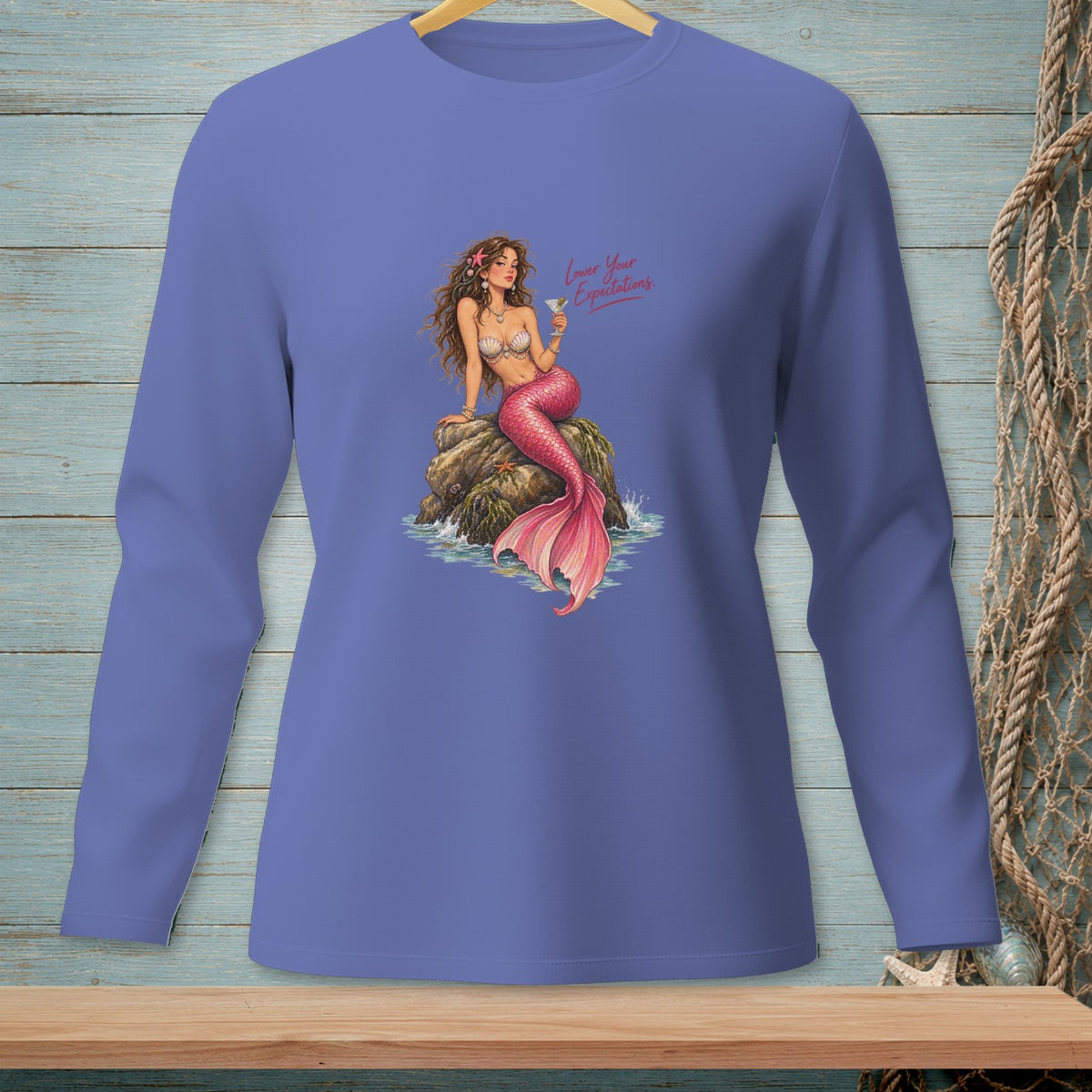 Periwinkle long-sleeve shirt with mermaid design and text "Lower Your Expectations."