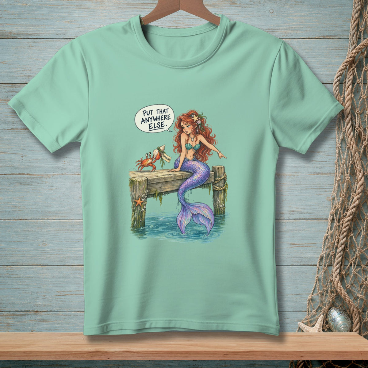 Mermaid on a dock tells a crab, "Put that anywhere else."