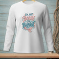 White long-sleeve shirt with text "I'm not bossy, I'm buoyant" and mermaid tail graphic.