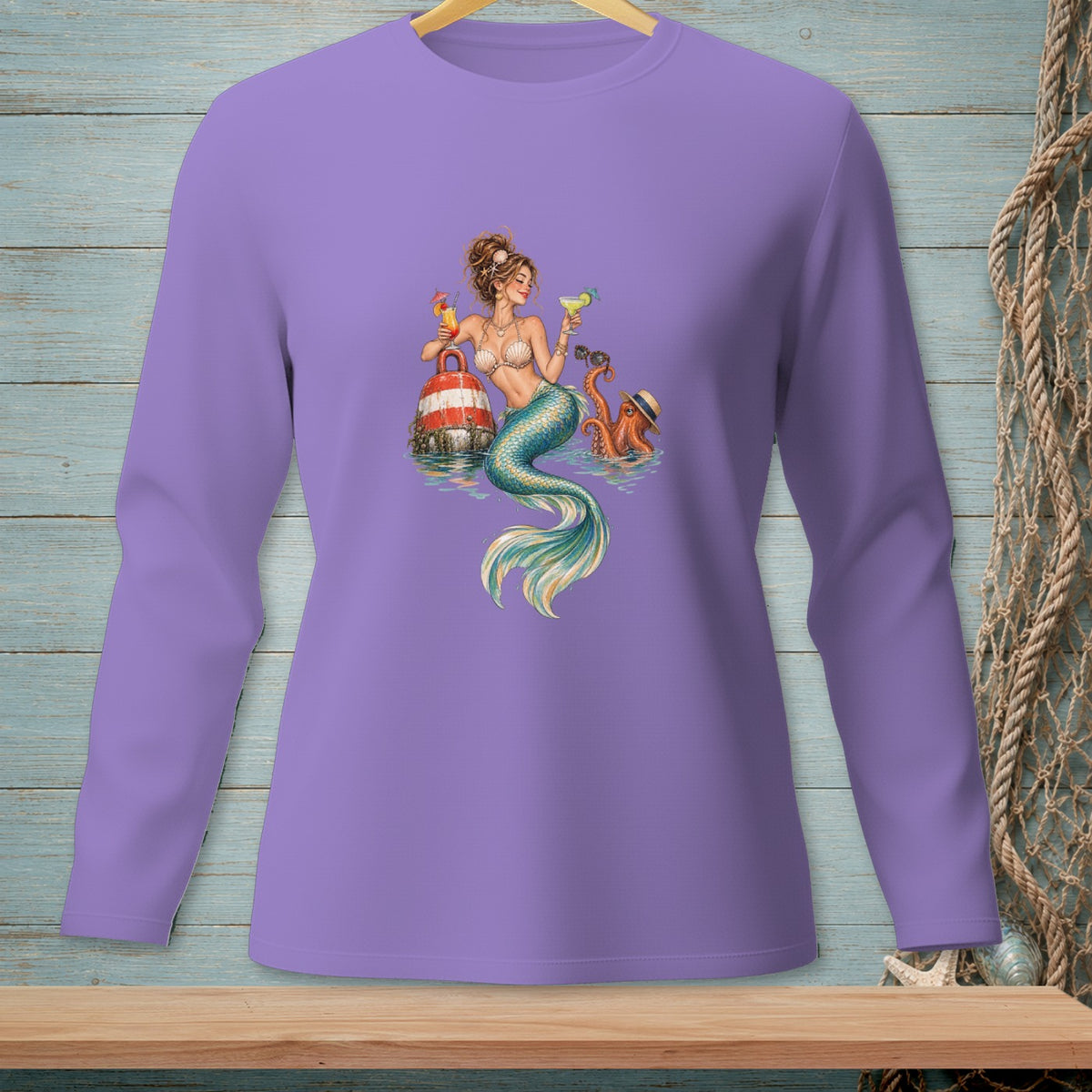 Long sleeve shirt with a mermaid and octopus drinking cocktails on a buoy.