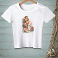 White t-shirt with a mermaid and octopus graphic on a wooden post.