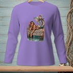 Purple long-sleeve shirt with a mermaid graphic reading "Whatever Floats Your Boat."