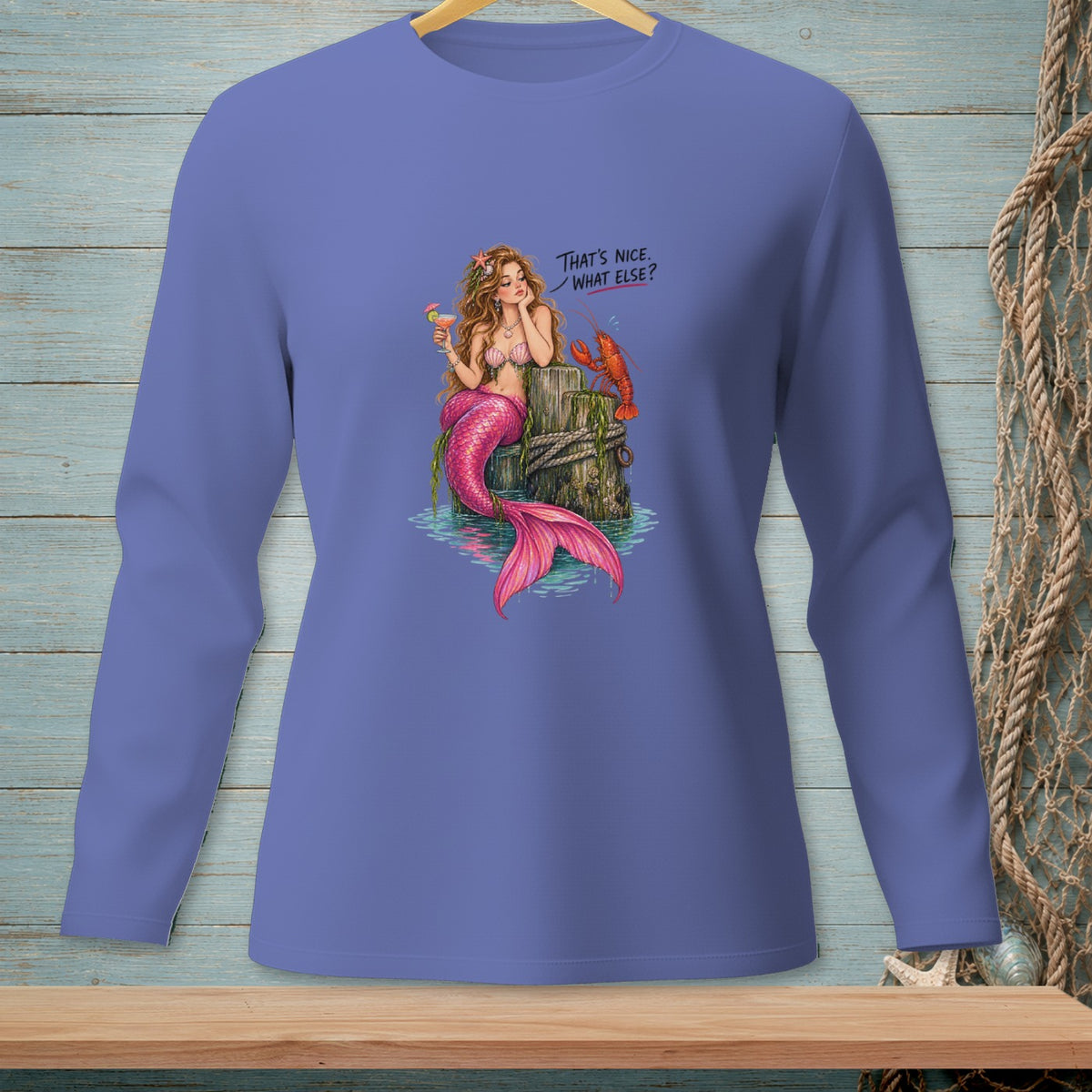 Mermaid with pink tail and cocktail sits by lobster; text says "That's nice. What else?"