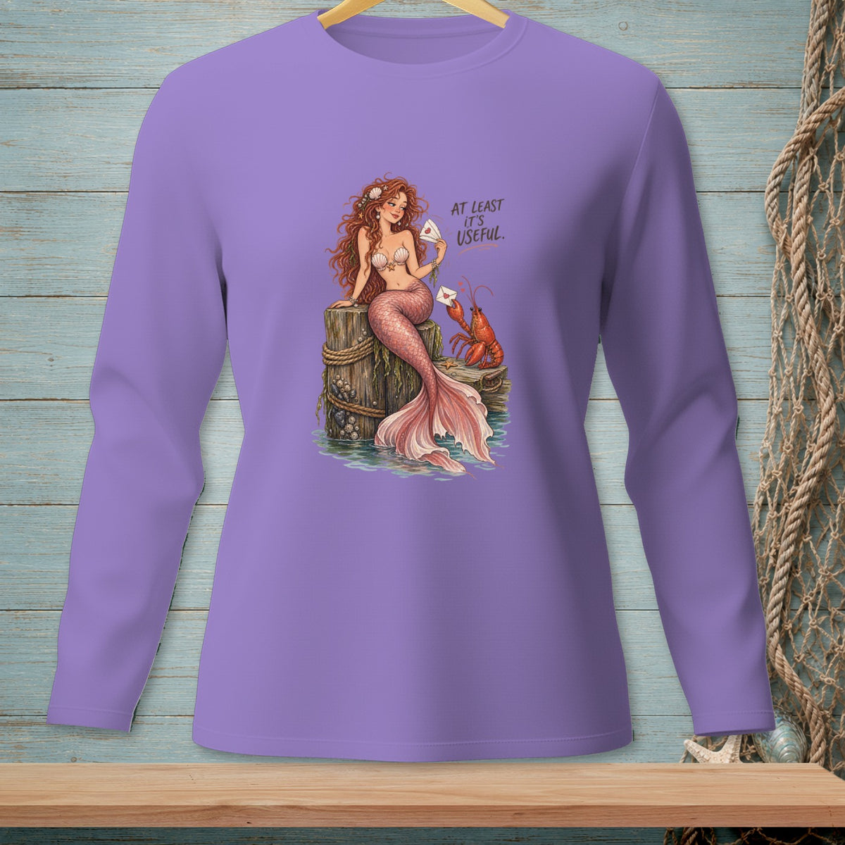 Mermaid and lobster receiving mail with text "AT LEAST IT'S USEFUL."