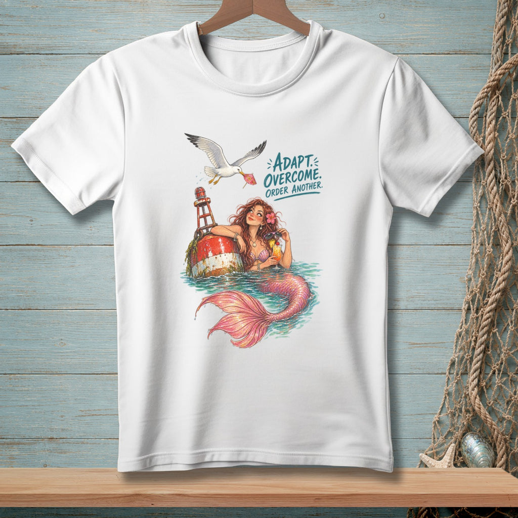White t-shirt with illustration of mermaid and seagull with text: ADAPT. OVERCOME. ORDER ANOTHER.