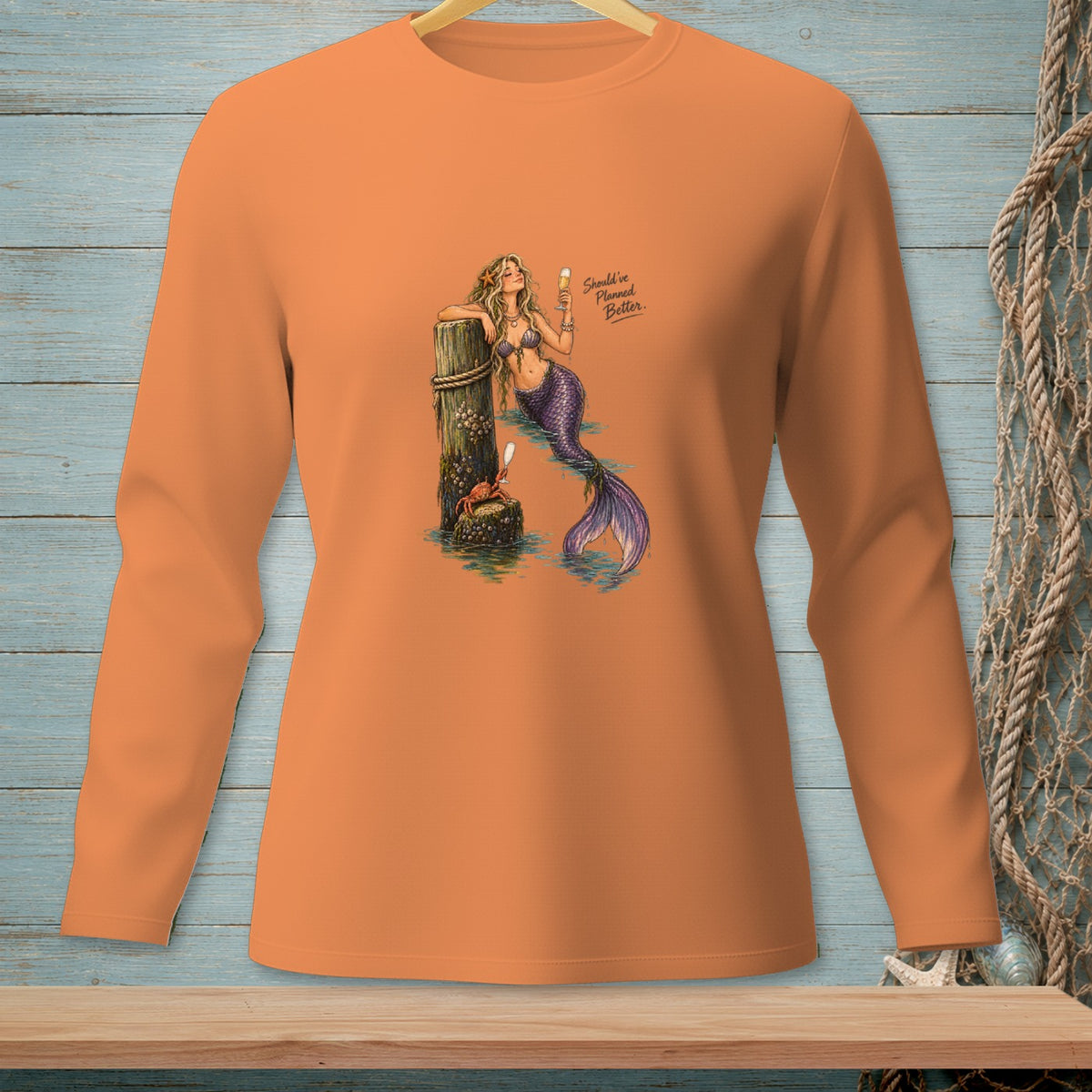 Orange long-sleeve shirt with a mermaid, crab, and text "Should've Planned Better."