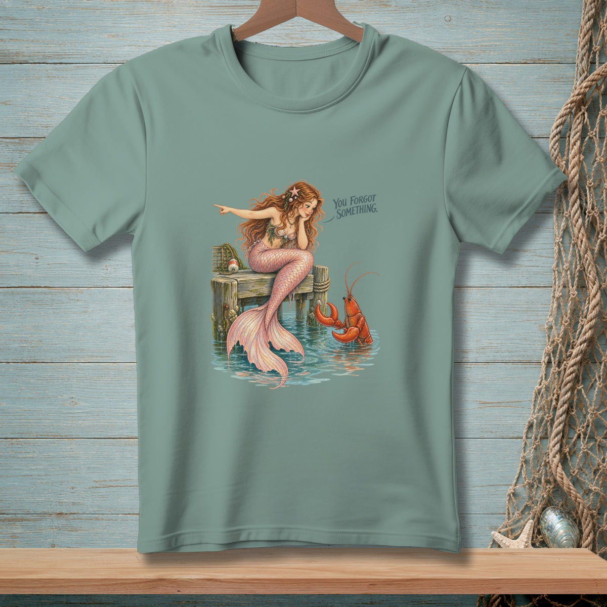 Mermaid on a dock points to a lobster with text "You forgot something."