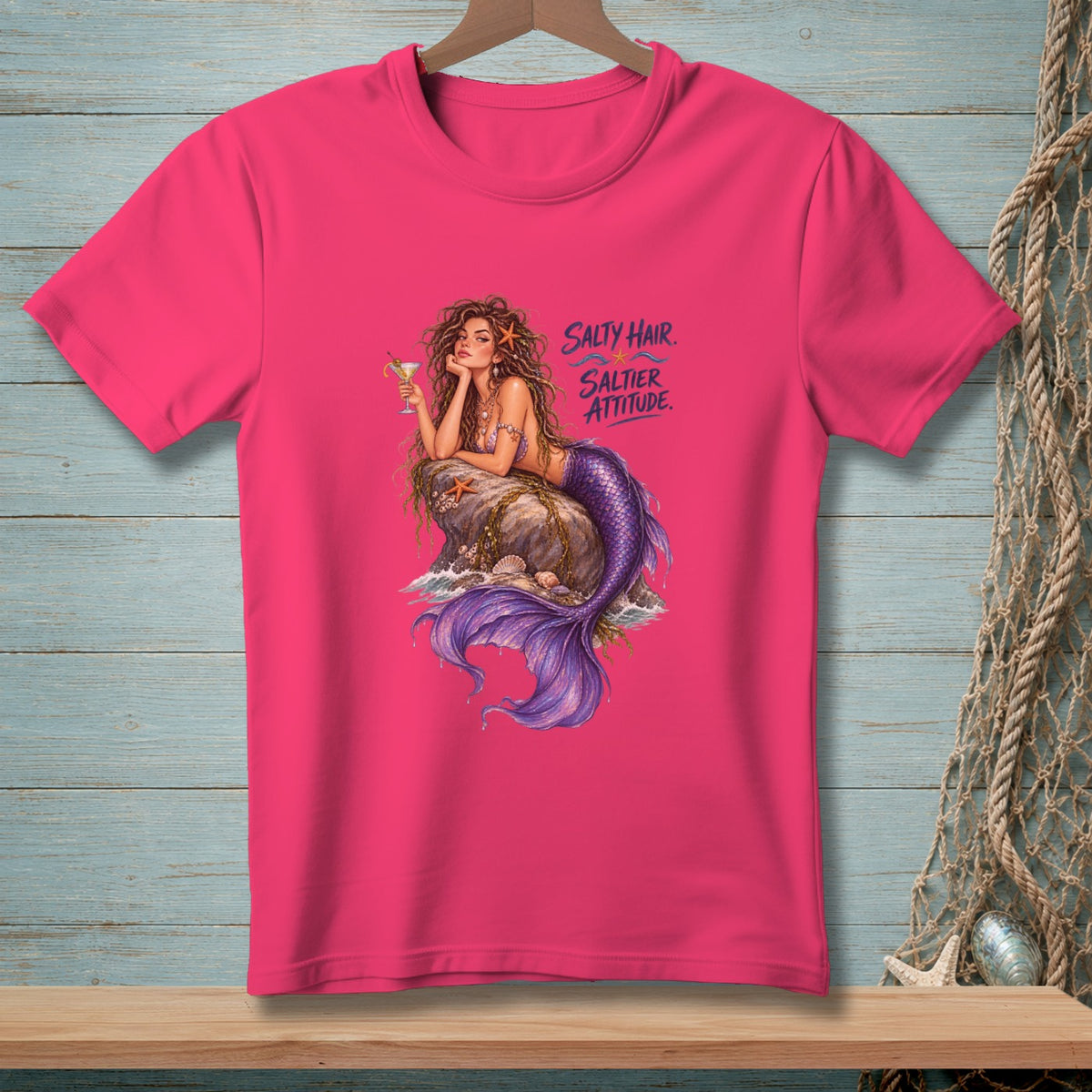 Pink t-shirt with mermaid illustration and text "Salty Hair. Saltier Attitude."