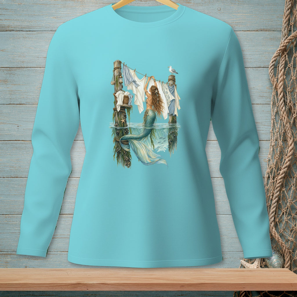 Mermaid hanging laundry on a clothesline in the ocean with a seagull.