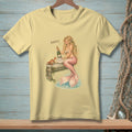 A mermaid holds champagne on a pier with a crab, the word "Perfect" is above.