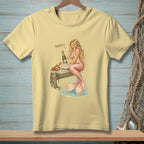 A mermaid holds champagne on a pier with a crab, the word "Perfect" is above.
