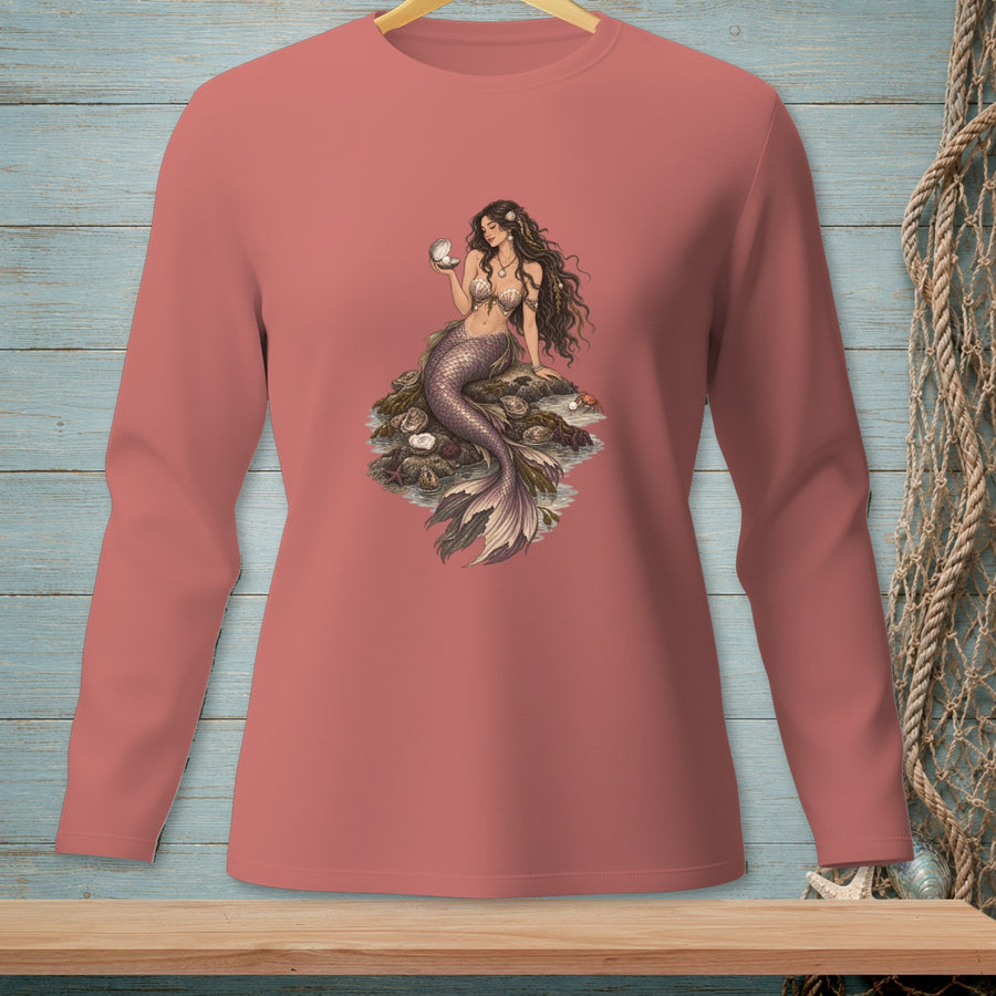 Pink long-sleeve shirt with a mermaid holding a pearl and sitting on rocks.