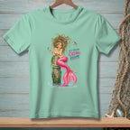 Mint green t-shirt with a mermaid sitting on a post, holding a drink, with "It's Called Ocean Volume" text.