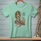 Mint green t-shirt with a mermaid, octopus, and text reading "THE SALT STAYS."
