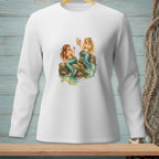 White long-sleeve shirt with two mermaids sitting on rocks with shells and starfish.