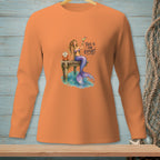 Orange long-sleeve shirt with a mermaid on a dock holding a drink.