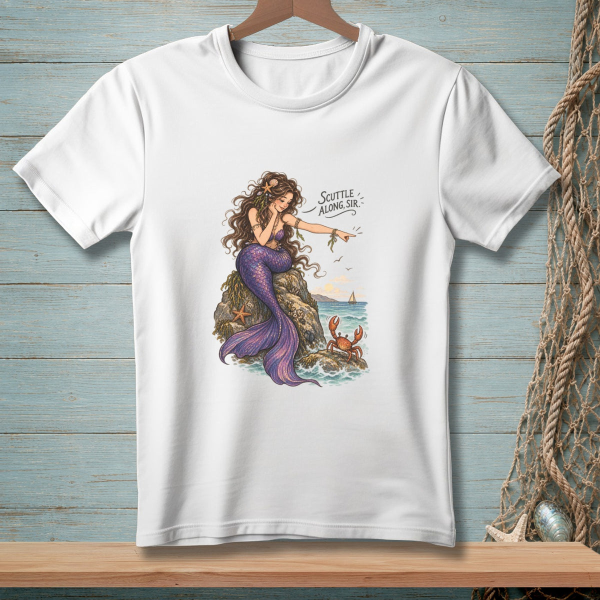 White t-shirt with a mermaid pointing to a crab and the text "Scuttle Along, Sir."