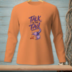 Orange long-sleeve shirt with "Talk to the Tail" text and mermaid tail illustration.