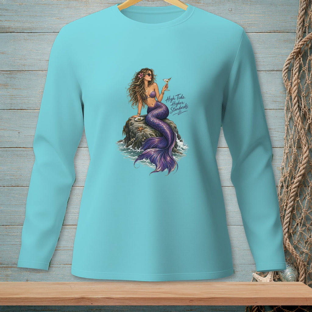 Turquoise long-sleeve shirt with a mermaid holding a cocktail on a rock.