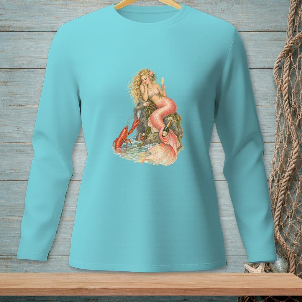 Mermaid with lobster and champagne on a rock, printed on a teal long-sleeve shirt.