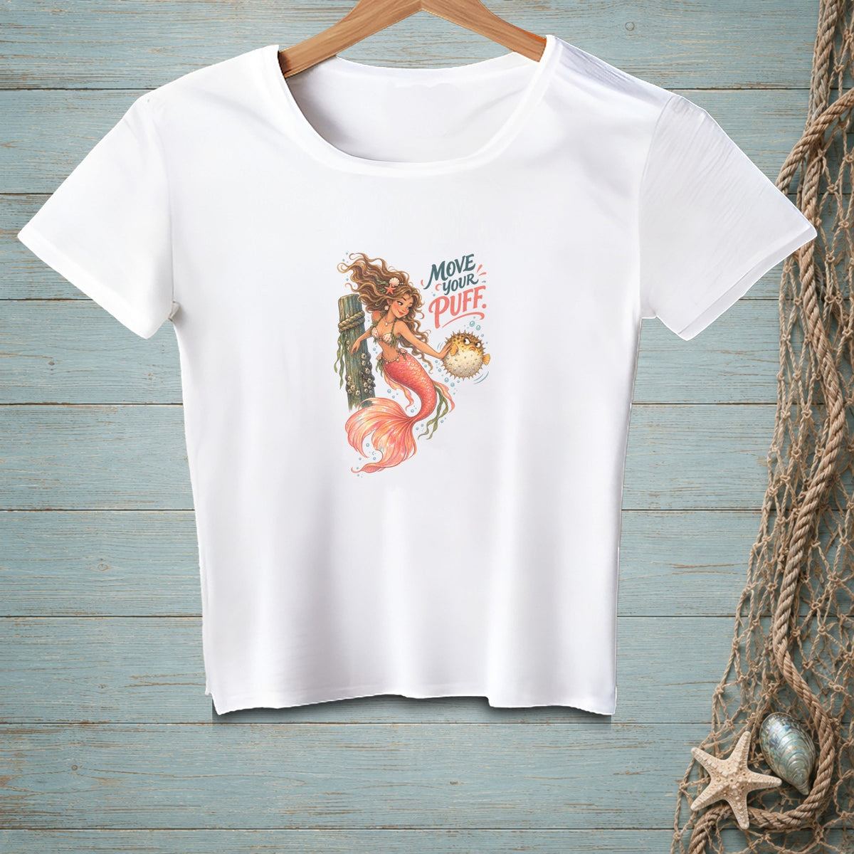 White t-shirt with a mermaid and pufferfish graphic and text "Move Your Puff".