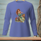 Illustration of a mermaid, crab, and picnic basket on rocks by the water.