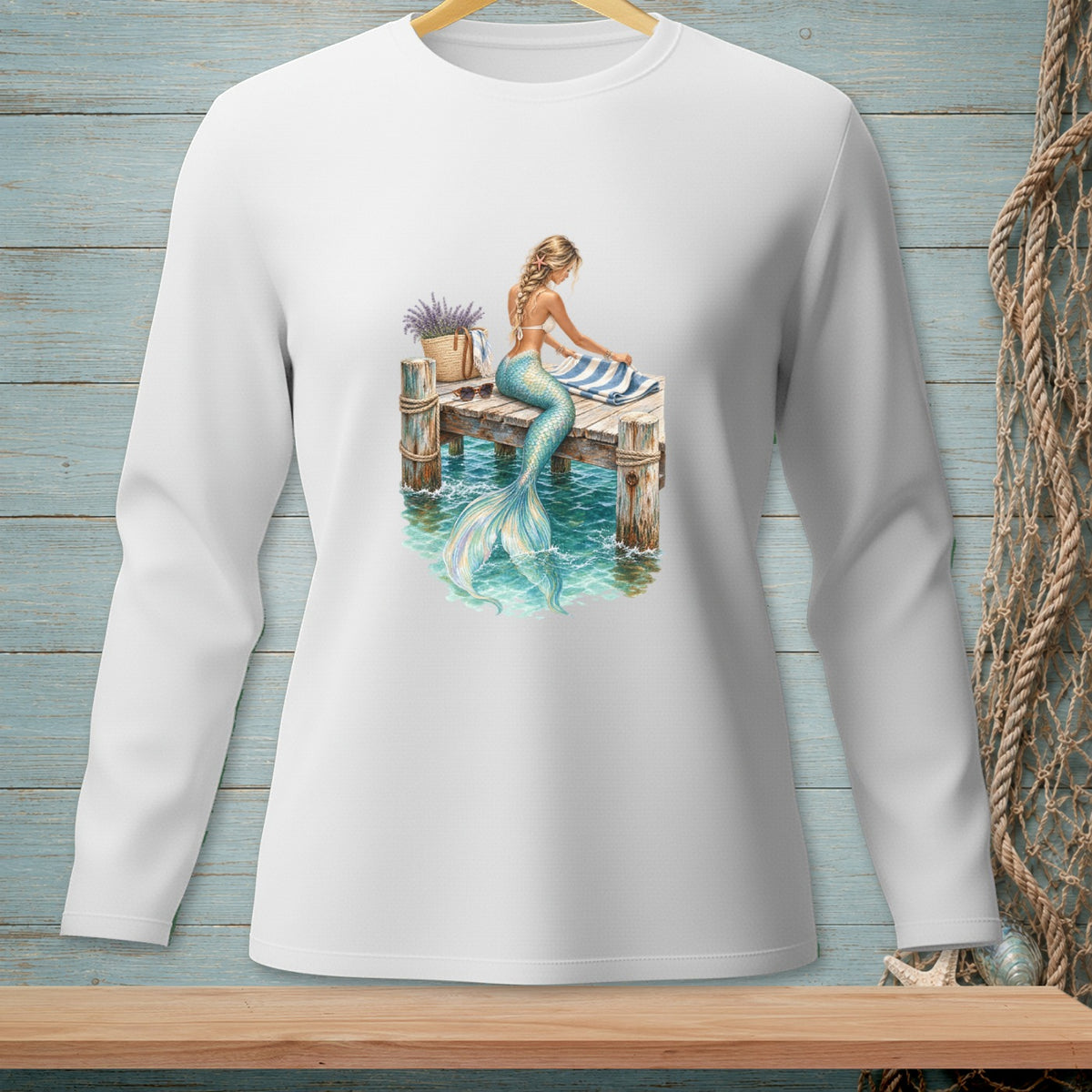 Illustration of a mermaid on a pier with a striped towel and a basket of flowers.