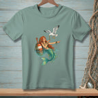 Mermaid with a seagull and orange buoy in the water.