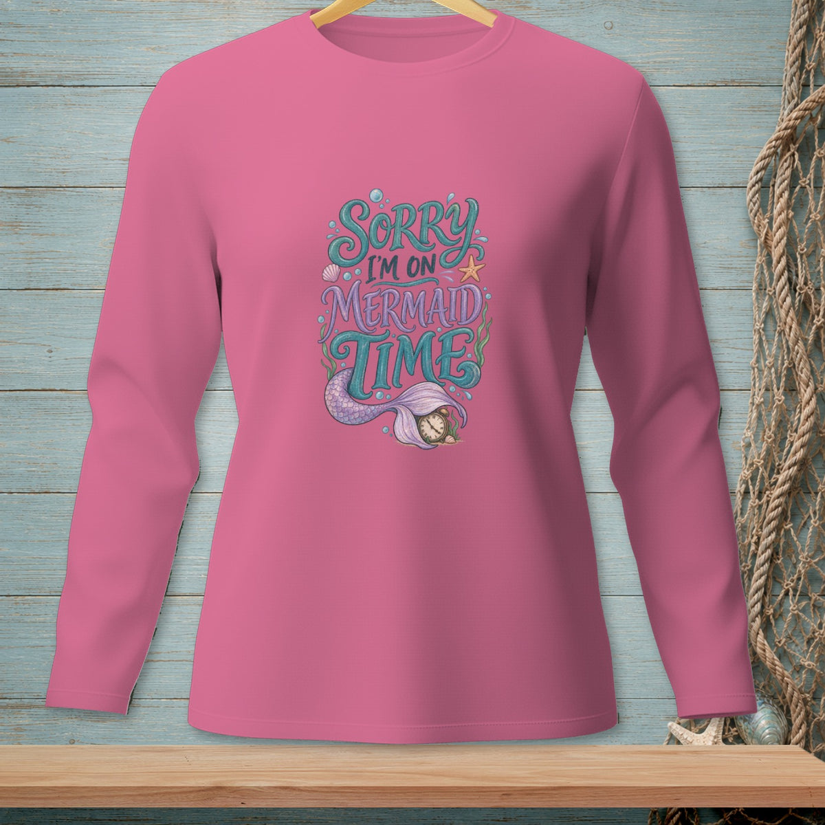 Pink long-sleeve shirt with "Sorry I'm on Mermaid Time" text and mermaid tail graphic.