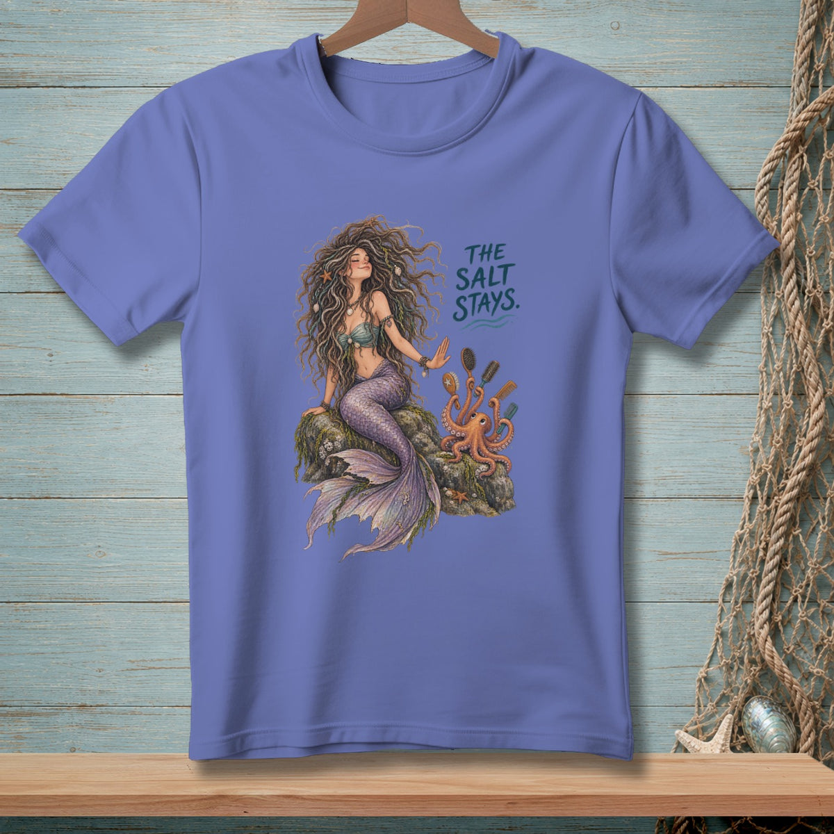 Mermaid on a rock with an octopus, text reads "THE SALT STAYS."