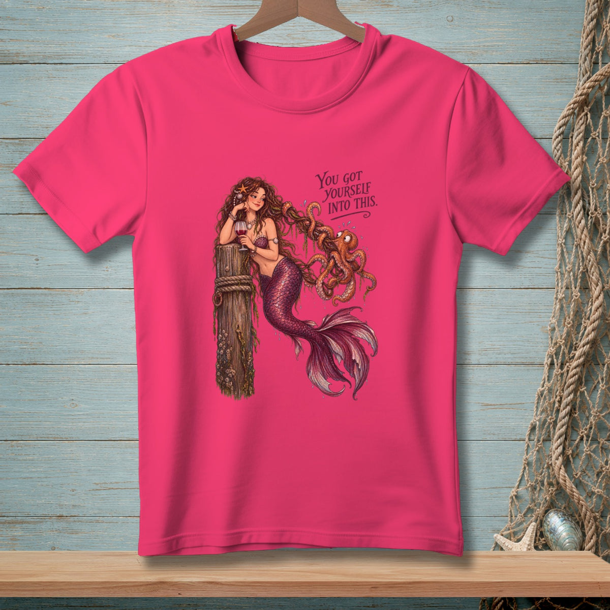 Pink t-shirt with a mermaid tangled with an octopus and text reading "You got yourself into this."