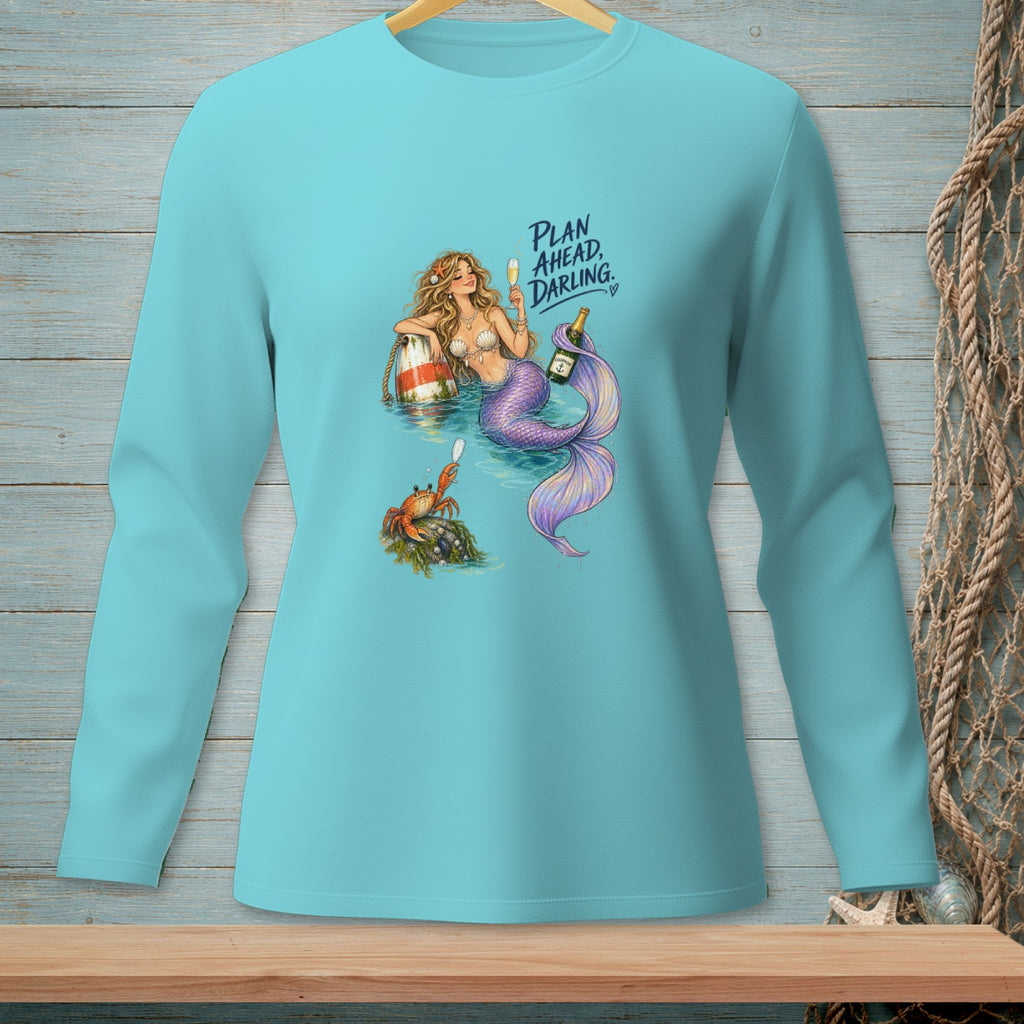 Mermaid with purple tail, crab, and text "PLAN AHEAD, DARLING" on blue shirt.