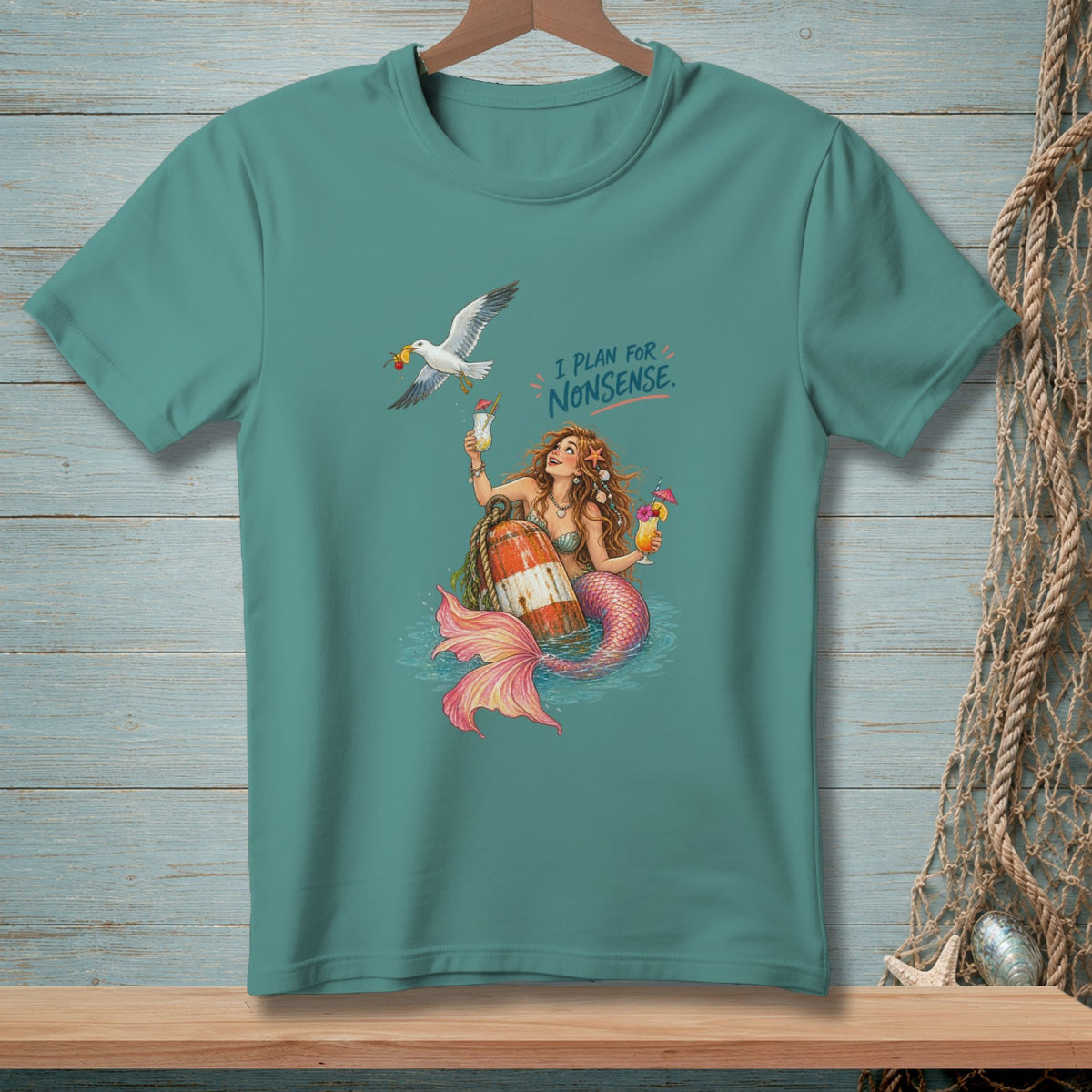 Mermaid holding cocktails with a seagull and text "I PLAN FOR NONSENSE."