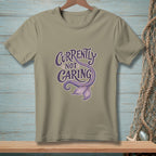 T-shirt with "Currently Not Caring" text and a purple mermaid tail graphic.
