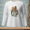 Two mermaids with colorful tails sit on a dock, one holding flowers.